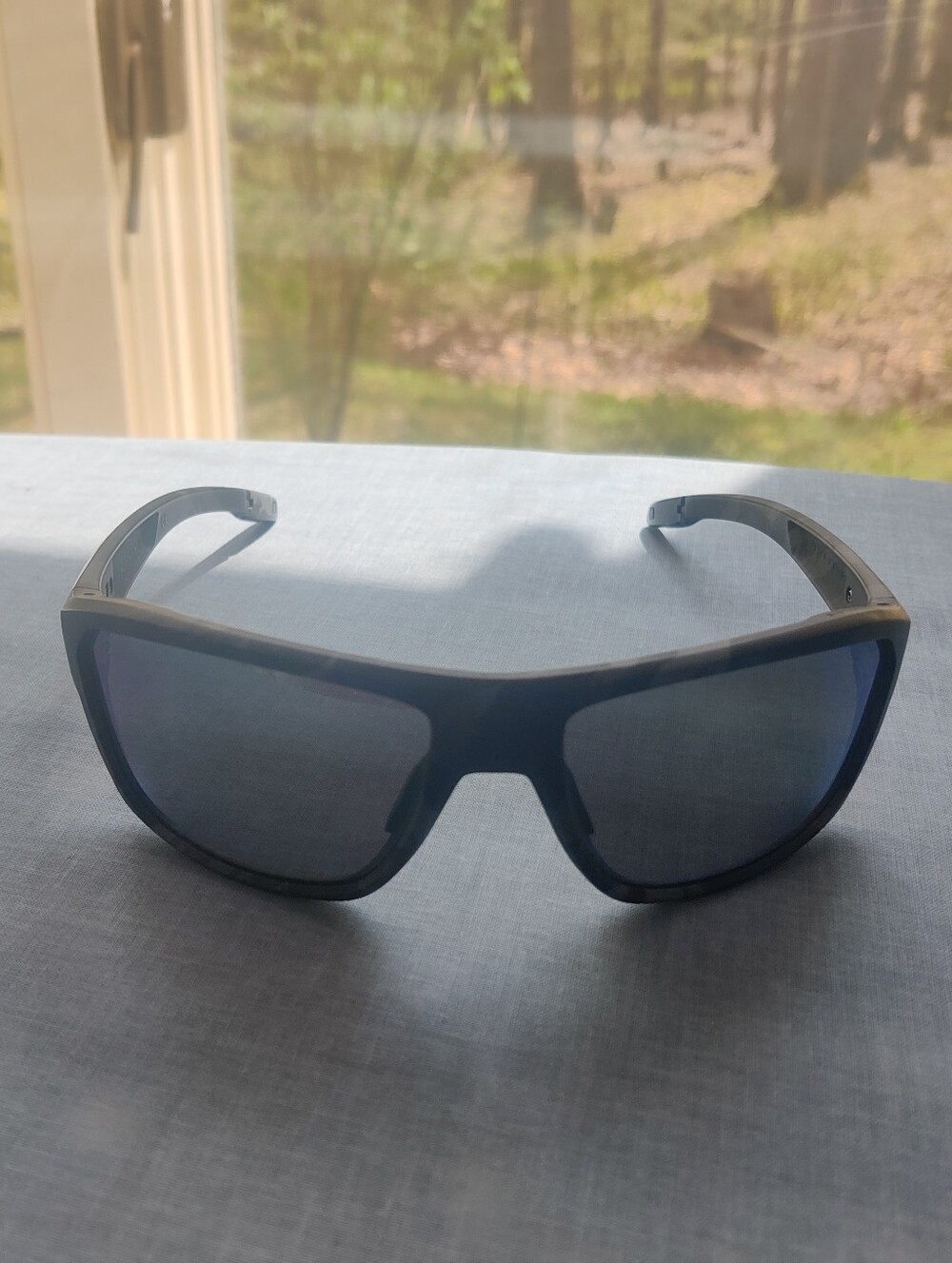 Oakley Men's Blue Frame Sunglasses with Blue Tint Lenses
